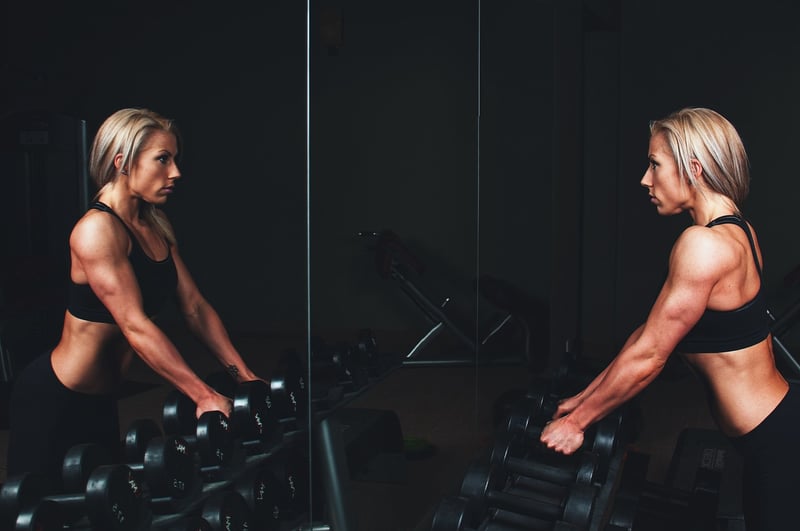 Woman practicing barre for posture improvement